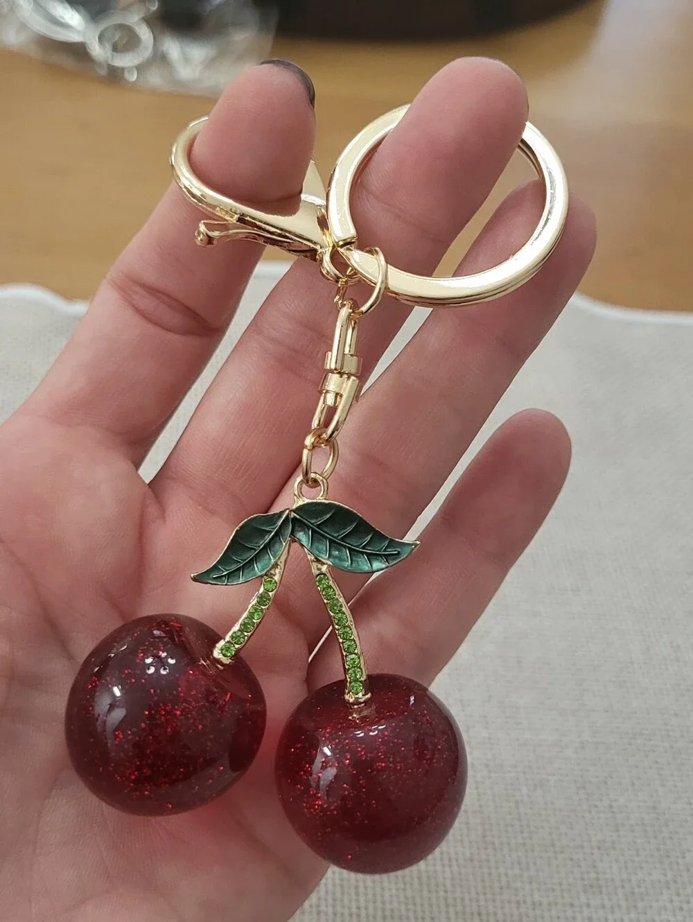 Gold-Tone Red Cherry Keychain with Green Accents